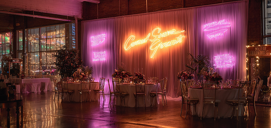 Vintage-style personalized neon wedding backdrop lights